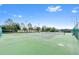 Community tennis courts with green surface and chain link fence surrounding at 13430 Early Frost Cir, Orlando, FL 32828