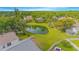 Lush backyard with a pond, surrounded by trees and well-maintained lawns at 13434 Mallard Cove Blvd, Orlando, FL 32837