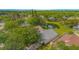 Beautiful aerial view of a home with a pond in the backyard and lush greenery at 13434 Mallard Cove Blvd, Orlando, FL 32837