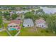 Expansive aerial view of a community with a large lake and homes with swimming pools at 13434 Mallard Cove Blvd, Orlando, FL 32837