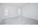 Bright bedroom with neutral walls and large windows at 13434 Mallard Cove Blvd, Orlando, FL 32837