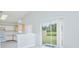 Open floor plan with kitchen and sliding glass door to backyard at 13434 Mallard Cove Blvd, Orlando, FL 32837