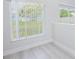 Bright living space with large windows and gray flooring and white trim at 13434 Mallard Cove Blvd, Orlando, FL 32837