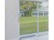 Patio doors that offers scenic views of a green, well-maintained backyard at 13434 Mallard Cove Blvd, Orlando, FL 32837