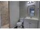 Bathroom featuring modern gray flooring, a stand up shower, and a sink with cabinet at 136 Country Club Dr, Sanford, FL 32771