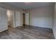 Spacious bedroom with a large closet and luxury vinyl plank flooring at 136 Country Club Dr, Sanford, FL 32771