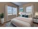 Comfortable bedroom featuring a large bed and bright natural lighting at 136 Country Club Dr, Sanford, FL 32771