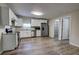 Updated kitchen with stainless steel appliances, ample cabinet space and luxury vinyl plank flooring at 136 Country Club Dr, Sanford, FL 32771