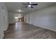 Modern living space with luxury vinyl plank flooring and an open layout connecting to the kitchen at 136 Country Club Dr, Sanford, FL 32771