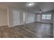 Inviting living area featuring luxury vinyl plank flooring and abundant natural light at 136 Country Club Dr, Sanford, FL 32771