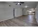 Open-concept living area with luxury vinyl plank flooring and seamless flow to the kitchen at 136 Country Club Dr, Sanford, FL 32771