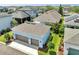 Aerial view of the property showcasing the detached garage and manicured landscaping at 13662 Behring Ave, Orlando, FL 32827