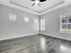 Bedroom with ceiling fan and multiple windows, providing natural light at 13662 Behring Ave, Orlando, FL 32827