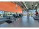 Well-lit fitness center offers modern equipment, large mirrors, and expansive windows for a refreshing workout experience at 13662 Behring Ave, Orlando, FL 32827