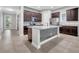 Stylish kitchen with center island, stainless appliances, and modern backsplash at 13662 Behring Ave, Orlando, FL 32827