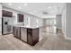 Open kitchen with granite counters, stainless steel appliances, and dark wood cabinetry at 13662 Behring Ave, Orlando, FL 32827