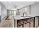 Spacious open-concept kitchen with island and stainless steel dishwasher at 13662 Behring Ave, Orlando, FL 32827