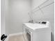 Laundry room equipped with washer, dryer, and wire shelving for storage at 13662 Behring Ave, Orlando, FL 32827