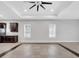 Open floorplan with tiled flooring, and kitchen with dark wood cabinetry at 13662 Behring Ave, Orlando, FL 32827