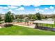 Community playground featuring modern equipment, a covered picnic area, and plenty of green space for Gathering fun at 13662 Behring Ave, Orlando, FL 32827