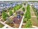 Aerial view of a charming neighborhood playground with lush landscaping, a slide, and play structures at 13662 Behring Ave, Orlando, FL 32827