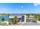 Scenic aerial view of a lakeside restaurant featuring contemporary architecture and outdoor seating at 13662 Behring Ave, Orlando, FL 32827