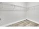 Walk-in closet with laminate floors and wire shelving at 13662 Behring Ave, Orlando, FL 32827