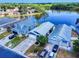Picture of beautiful blue houses next to a serene lake, lush greenery, and a tranquil living experience at 148 Meadow Blvd, Sanford, FL 32771