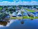 Picture of lakeside community featuring well-maintained houses and green landscaping, offering a scenic living environment at 148 Meadow Blvd, Sanford, FL 32771