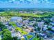 Aerial view of the neighborhood and surrounding area with lush greenery and lakes at 148 Meadow Blvd, Sanford, FL 32771