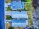Overhead view showcasing lakefront houses, meticulously maintained lawns, and peaceful neighborhood setting at 148 Meadow Blvd, Sanford, FL 32771