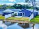 Backyard view of home with a pond at 148 Meadow Blvd, Sanford, FL 32771
