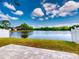 Backyard view featuring a serene lake with a lush grassy area at 148 Meadow Blvd, Sanford, FL 32771