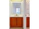 Bathroom with single sink vanity with wood cabinets at 148 Meadow Blvd, Sanford, FL 32771