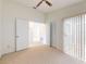 Empty bedroom with ceiling fan, closet, and sliding door to the outside at 148 Meadow Blvd, Sanford, FL 32771