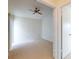 Spacious bedroom with neutral carpet, ceiling fan, and large windows for natural light at 148 Meadow Blvd, Sanford, FL 32771