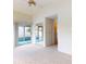 Bright bedroom with mirrored closets and sliding doors to the outside, providing an airy and open feel at 148 Meadow Blvd, Sanford, FL 32771