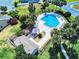Aerial shot of a community pool area surrounded by lush greenery, offering a serene recreational space at 148 Meadow Blvd, Sanford, FL 32771