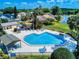 A fantastic overhead view of a well-maintained community pool area with lounge chairs and landscaping at 148 Meadow Blvd, Sanford, FL 32771