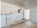 Garage featuring a washer, dryer, and access door to the home's interior at 148 Meadow Blvd, Sanford, FL 32771