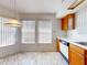 Bright breakfast nook area with large windows, pendant lighting, and views of the kitchen and cabinetry at 148 Meadow Blvd, Sanford, FL 32771