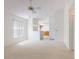 Open-concept living area with plush carpeting, neutral walls, and views of the kitchen at 148 Meadow Blvd, Sanford, FL 32771