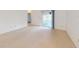 Bright living room with sliding glass doors leading to the outdoors and neutral carpeting at 148 Meadow Blvd, Sanford, FL 32771