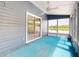 Relaxing sunroom offering lake views, ceiling fan, and glass sliding doors at 148 Meadow Blvd, Sanford, FL 32771