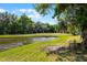 Backyard view of the pond at 1527 Braewick St, Winter Springs, FL 32708