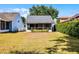 The backyard has a screened in patio at 1527 Braewick St, Winter Springs, FL 32708