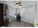 This bedroom has a desk area, ceiling fan, and a built in Murphy bed at 1527 Braewick St, Winter Springs, FL 32708
