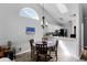 Bright dining area adjacent to kitchen featuring modern flooring, chandelier, and natural light at 1527 Braewick St, Winter Springs, FL 32708