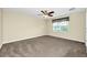 Bedroom featuring carpeted floor, neutral walls, ceiling fan, and a window at 15366 Sandfield Loop, Winter Garden, FL 34787