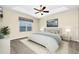 Serene main bedroom with tray ceiling and plush carpeting at 15366 Sandfield Loop, Winter Garden, FL 34787